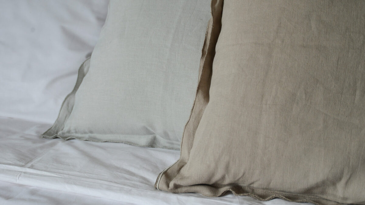 linen ruffle edge cushions in a choice of pale grey or taupe a detail view