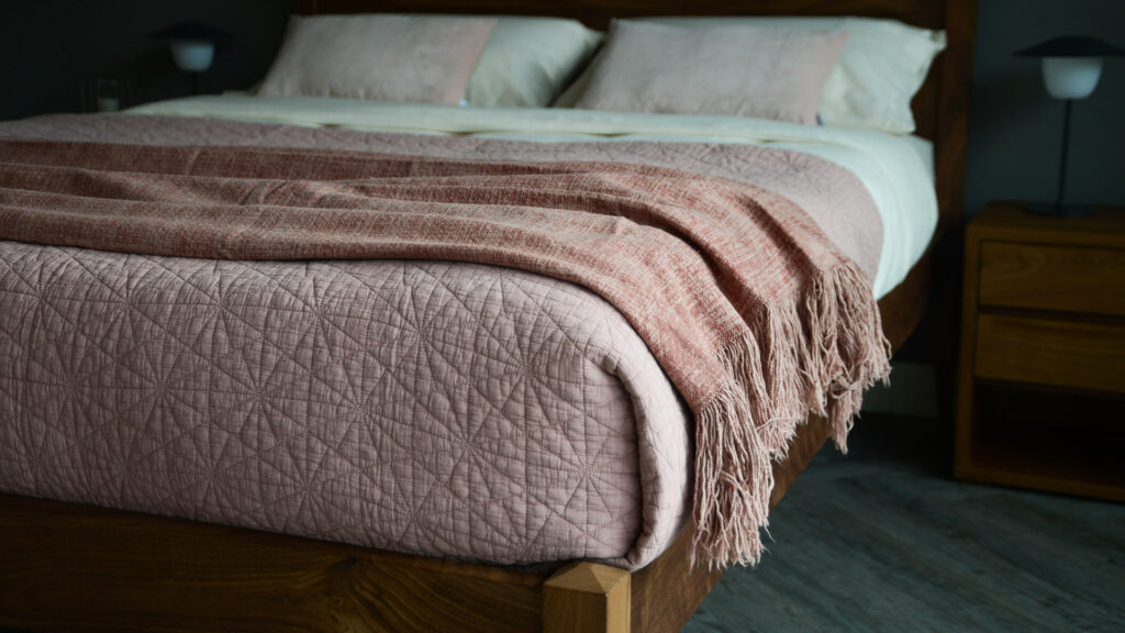 blush pink hexagon stitched quilted bedspread