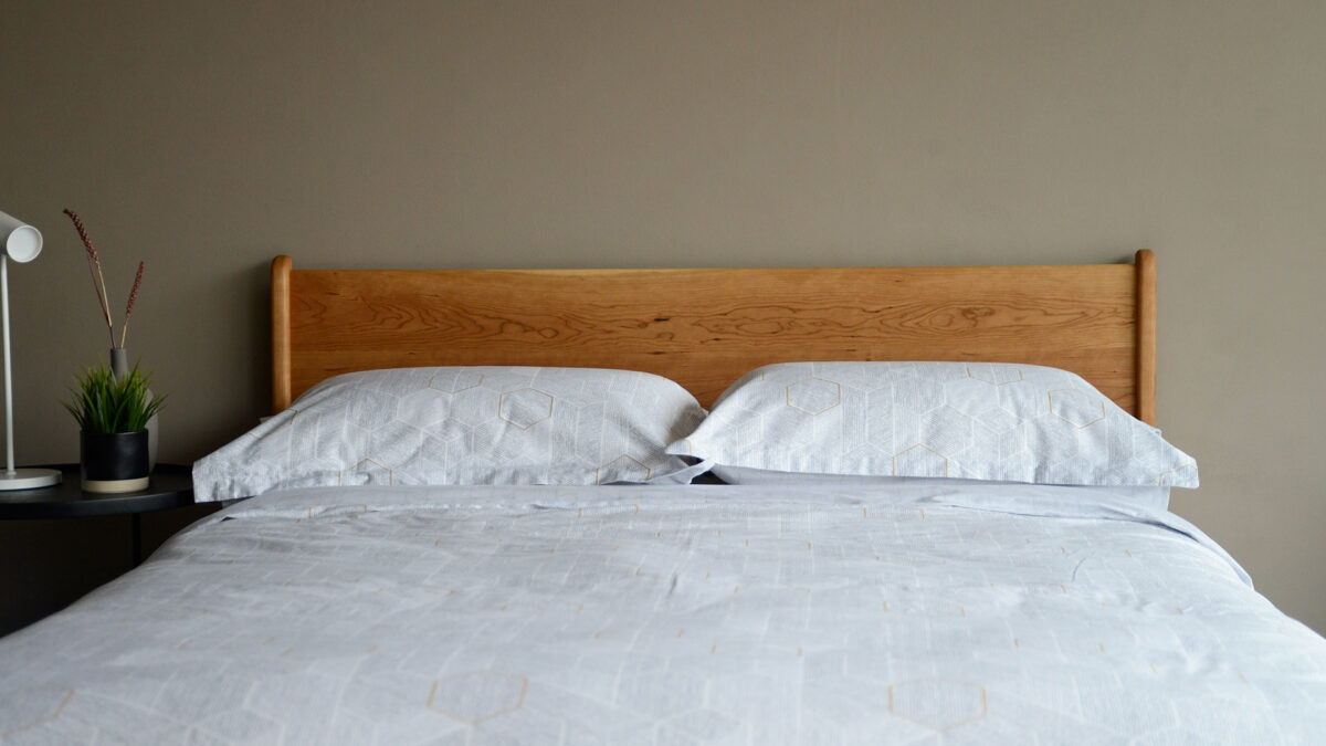 honeycomb print duvet set shown on a solid cherry wood camden bed