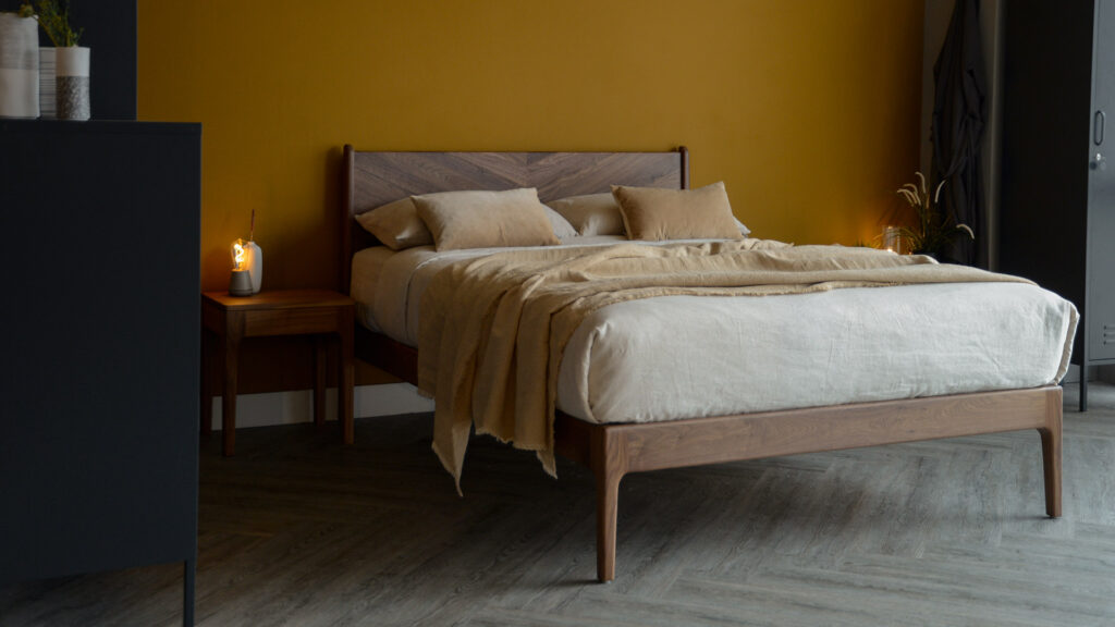 the Hoxton handcrafted solid wood bed with chevron pattern headboard here it is made in Walnut