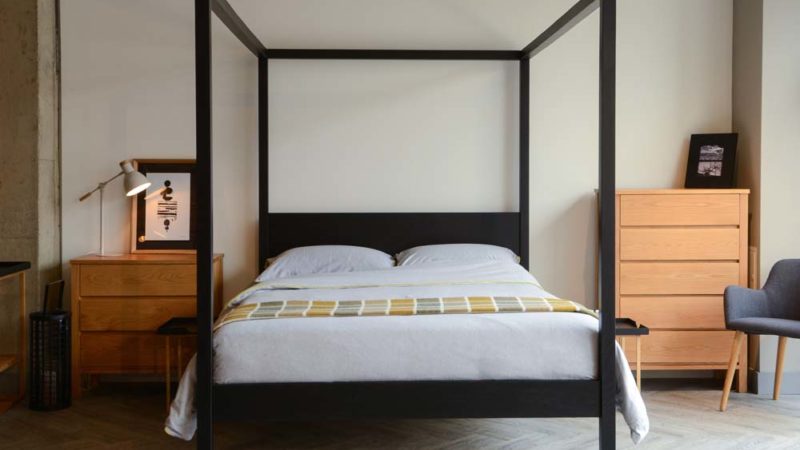 Introducing our black four poster wooden bed - the Black Orchid