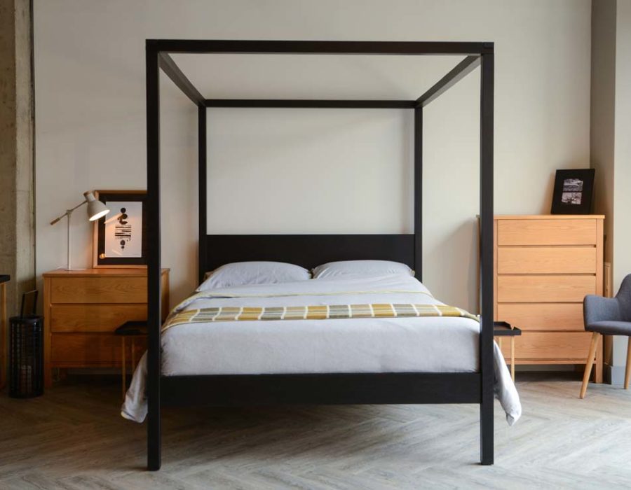 Introducing our black four poster wooden bed - the Black Orchid