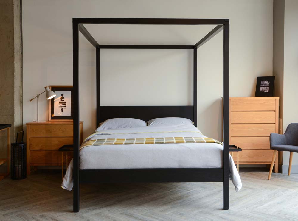 Introducing our black four poster wooden bed - the Black Orchid