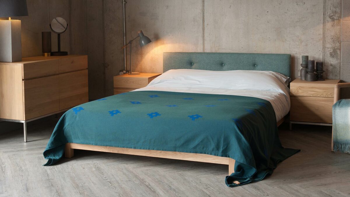 low wooden bed frame with upholstered headboard - the Iona Bed