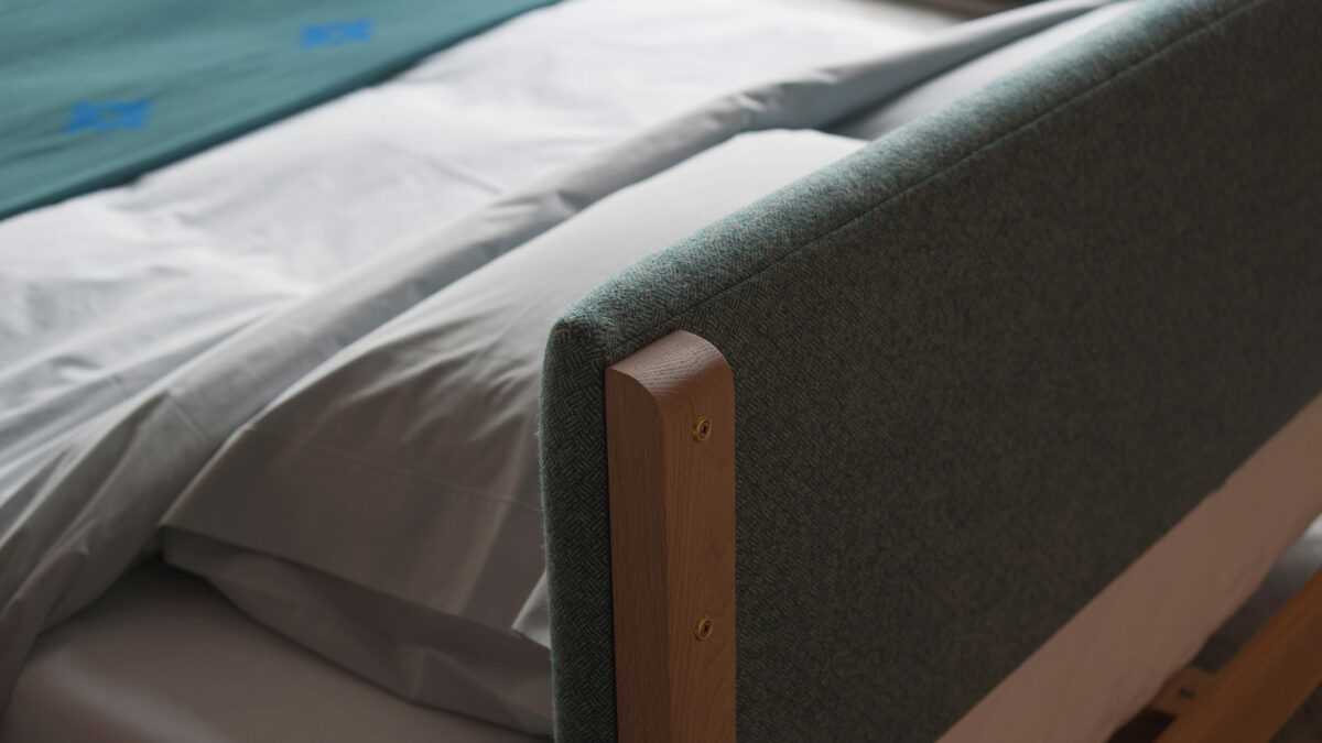 A detail view of the back of the low bed Iona beds padded-headboard