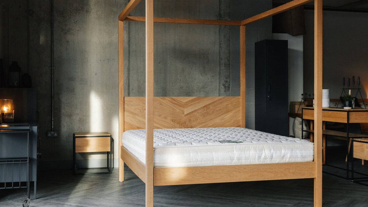 A view of the Kelham contemporary wooden 4 Poster bed shown without bedding