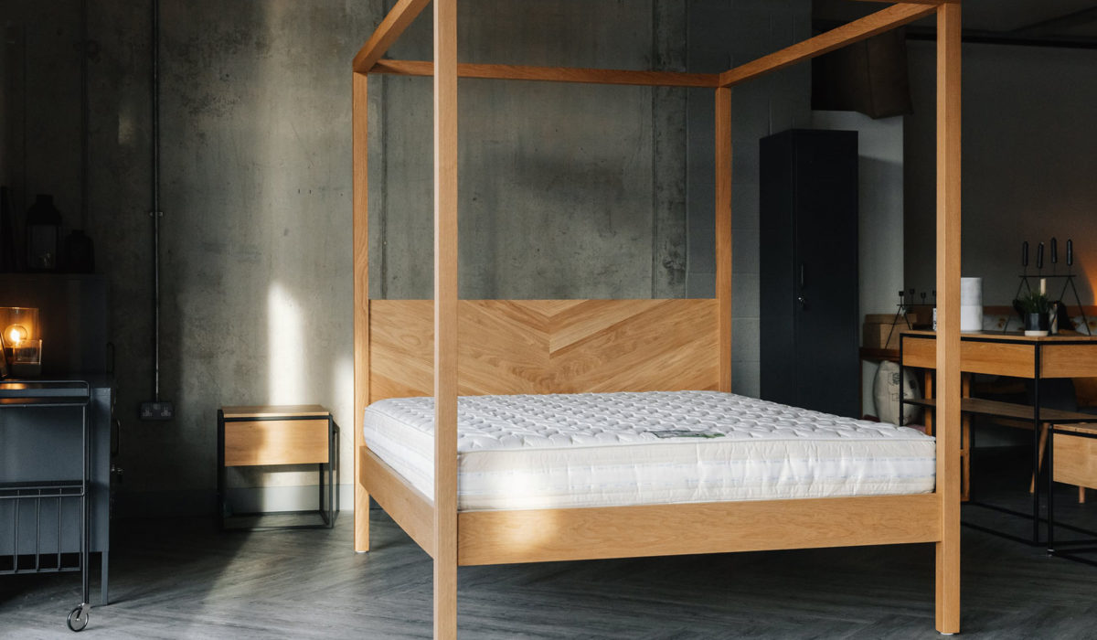 A view of the Kelham contemporary wooden 4 Poster bed shown without bedding