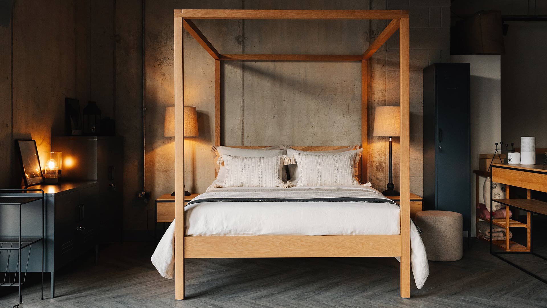 Cosy industrial bedroom featuring the hand made solid wooden Kelham 4 Poster bed in Oak