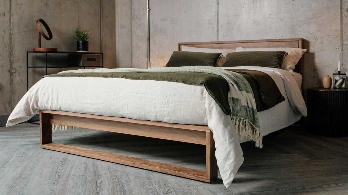 Leith modern bed in solid walnut with green accessories