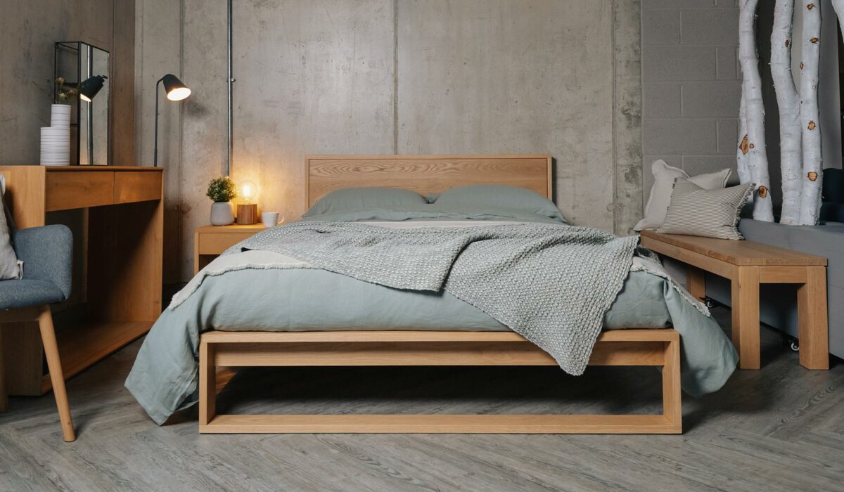 Scandinavian style bedroom - pale sage coloured linen bedding on our solid oak Leith bed