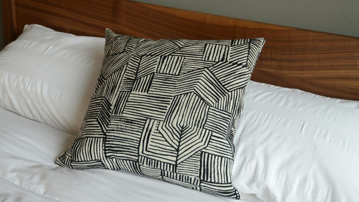 Black and white lines pattern cushion by Donna Wilson