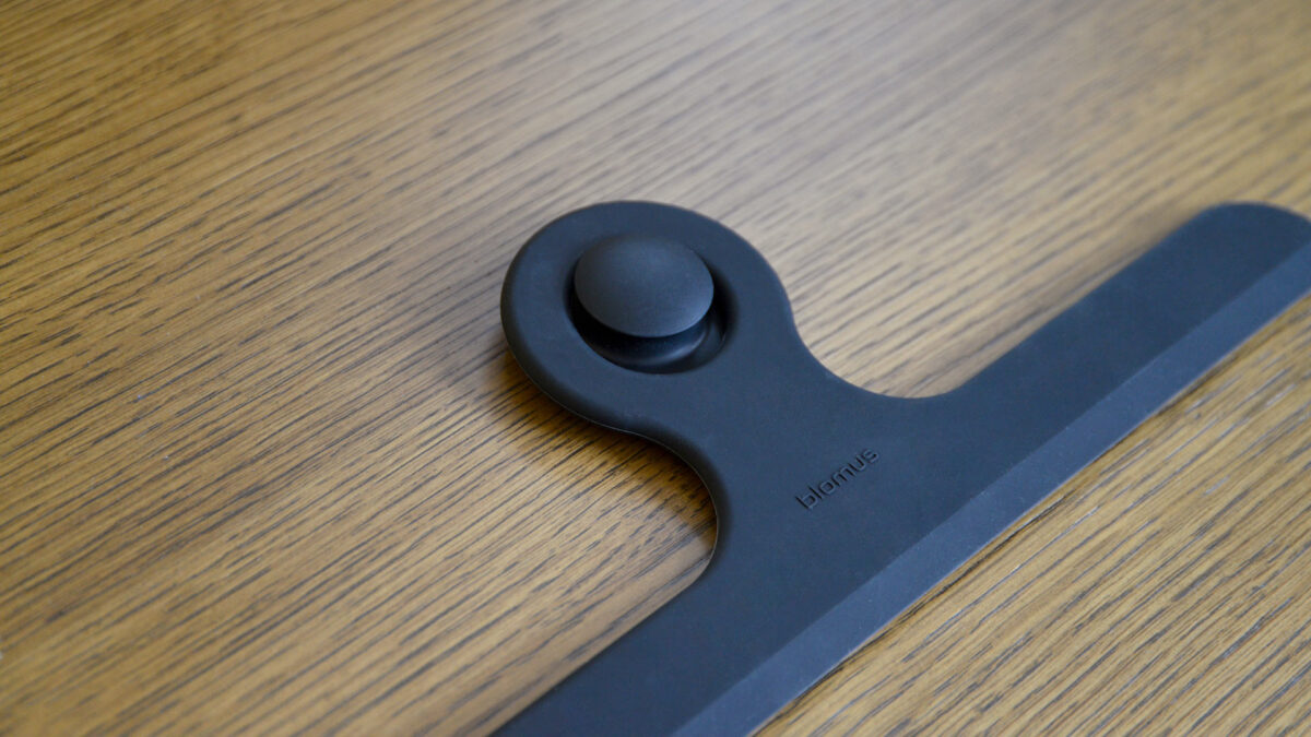 Close up of a black shower wiper.