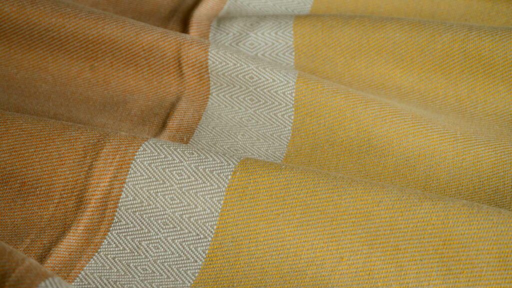 Irish linen woven throw in yellow, orange and sand colours