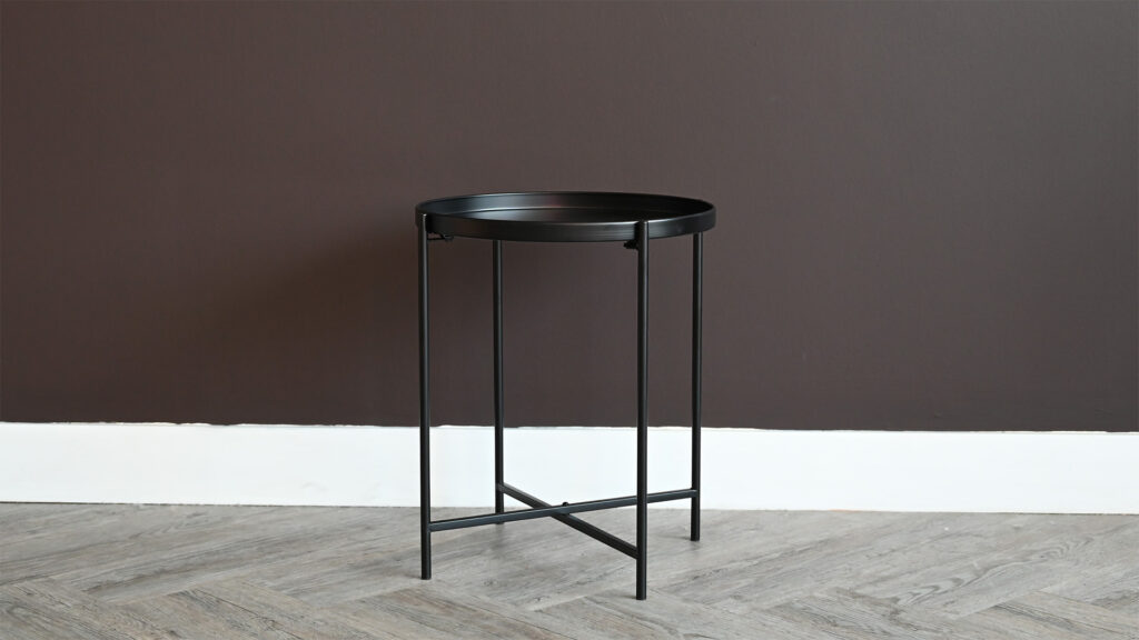 tall round black metal table.