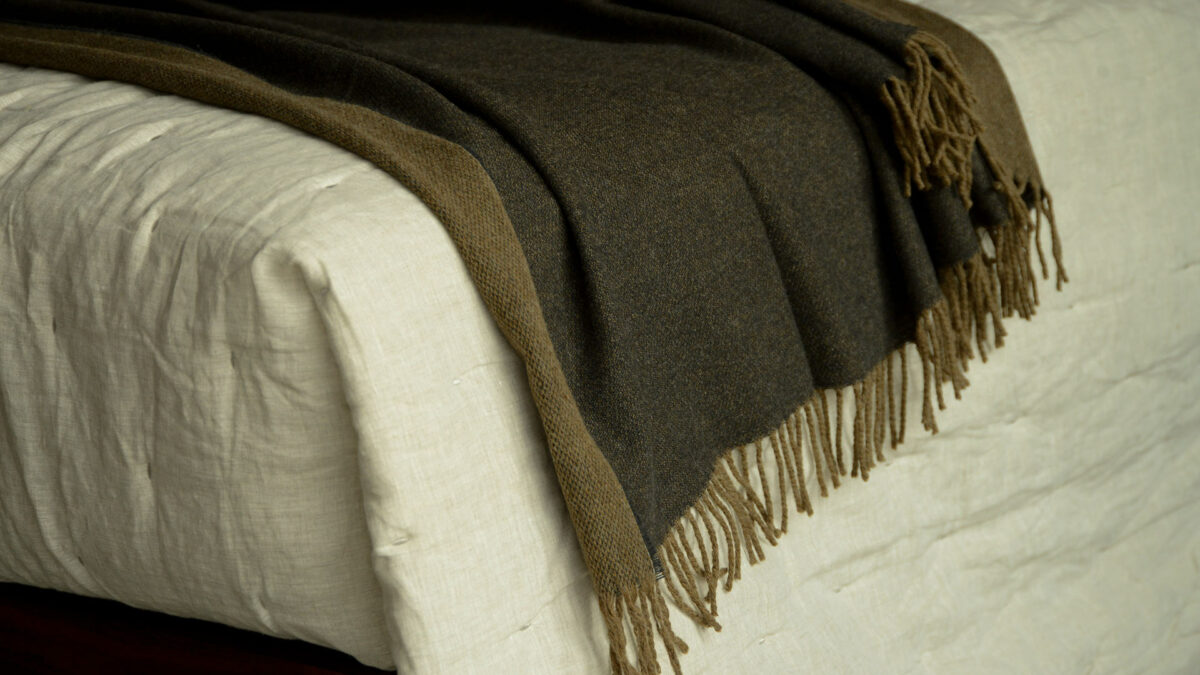 Mocha Wool Throw on Linen Bedding Tassel Detail