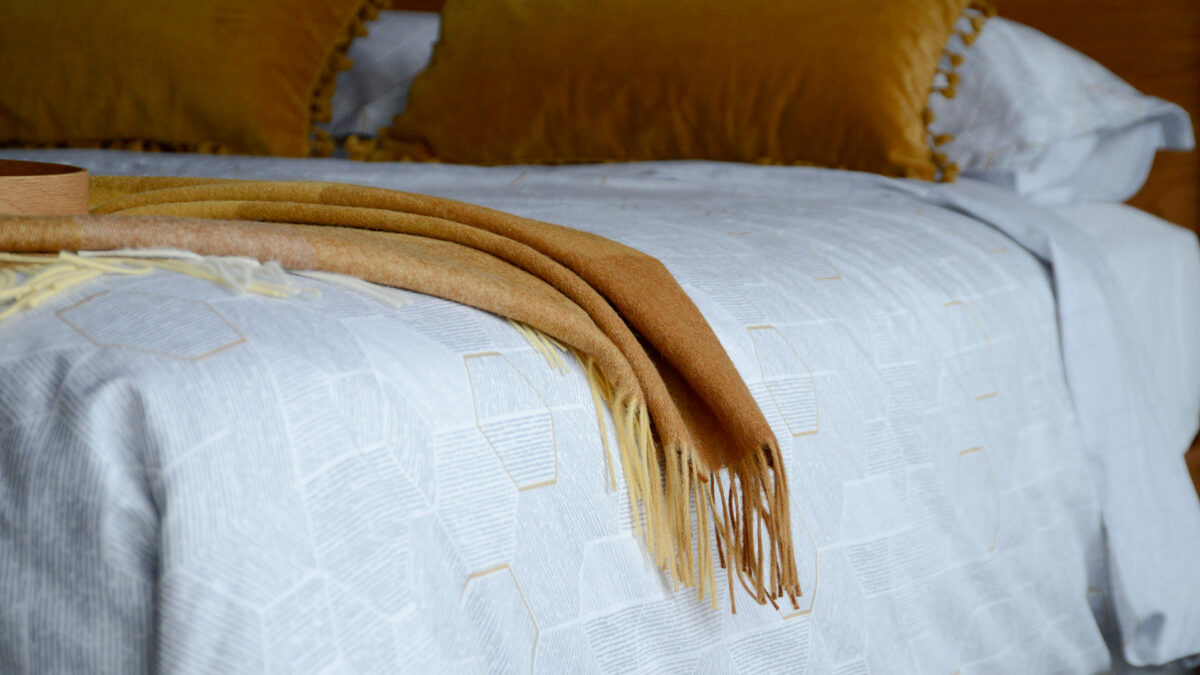 Mustard Gradient Throw on Gold Hexagon Bedding