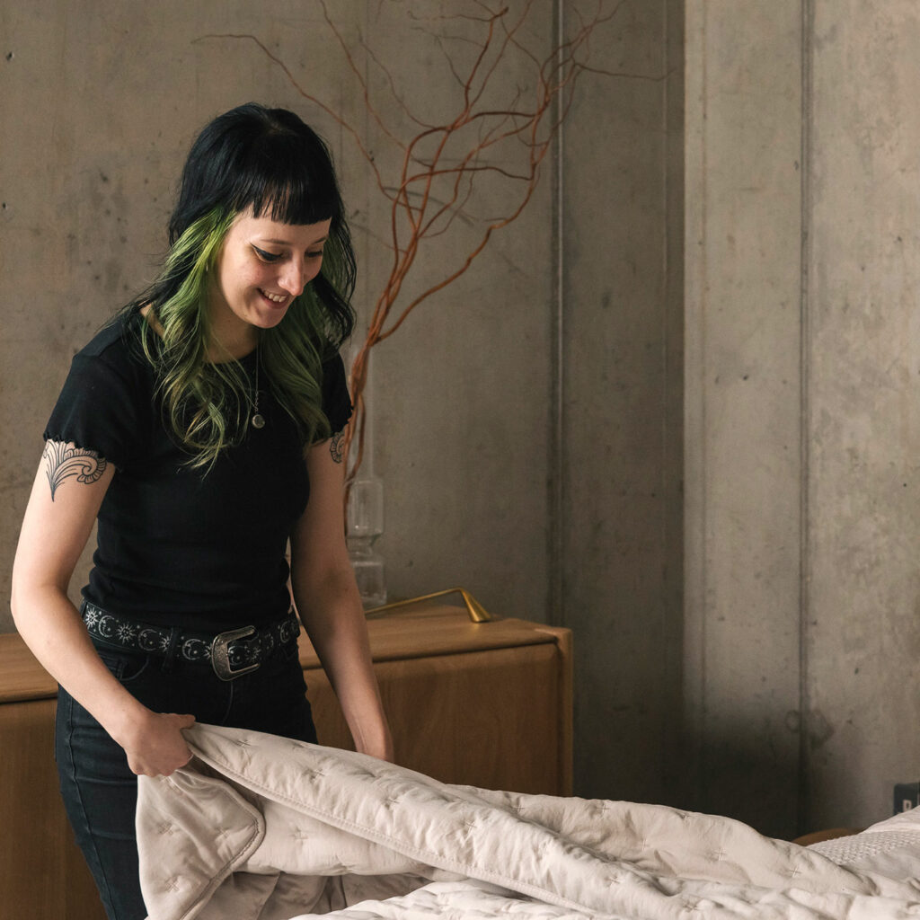 Nicole dressing a bed