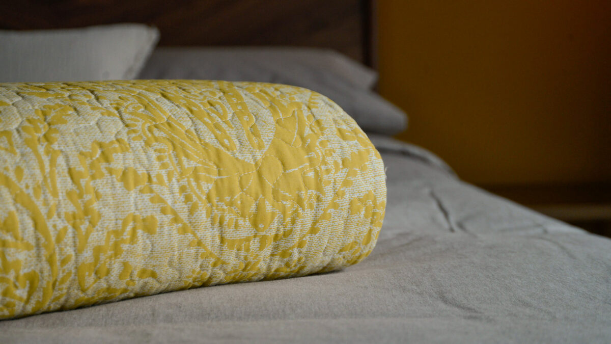 reversible printed floral damask pattern quilted bedspread in ivory and yellow ochre