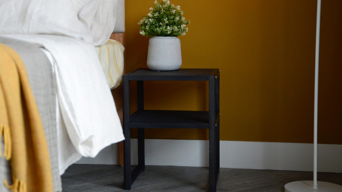 open shelf wooden bedside table with a dark earth stain