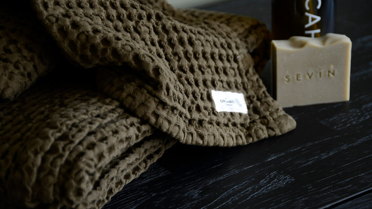 organic cotton waffle weave towel in a chocolate brown colour