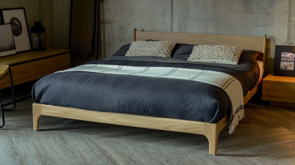 A low version of our mid-century style Camden bed - the Pimlico here is in solid Oak