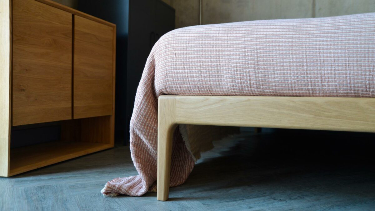 reversible textured cotton bedspread pink striped one side plain cream reverse a close-up view