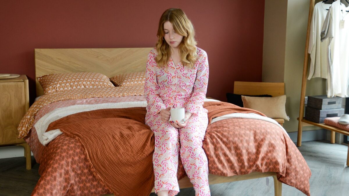 Pink Orange PJs Shirt on Model sat on Oak Highbury