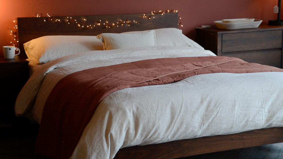 Plain Soft Bedspread Terracotta over Linen Bedding