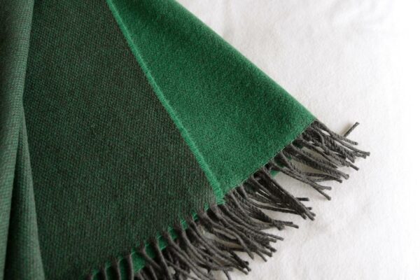 reversible emerald green merino lambswool throw with dark fringing