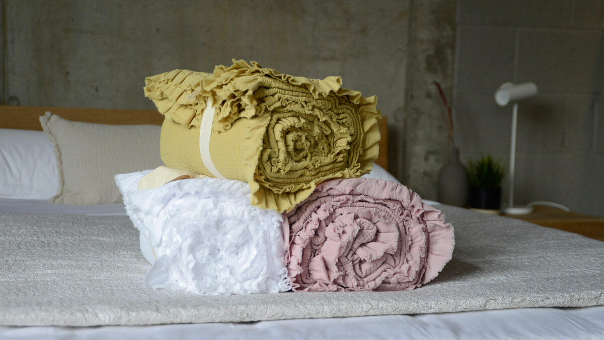 crinkle textured cotton bedspreads with ruffle edges and in a choice of 3 colours