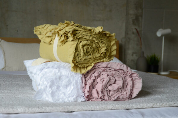 crinkle textured cotton bedspreads with ruffle edges and in a choice of 3 colours