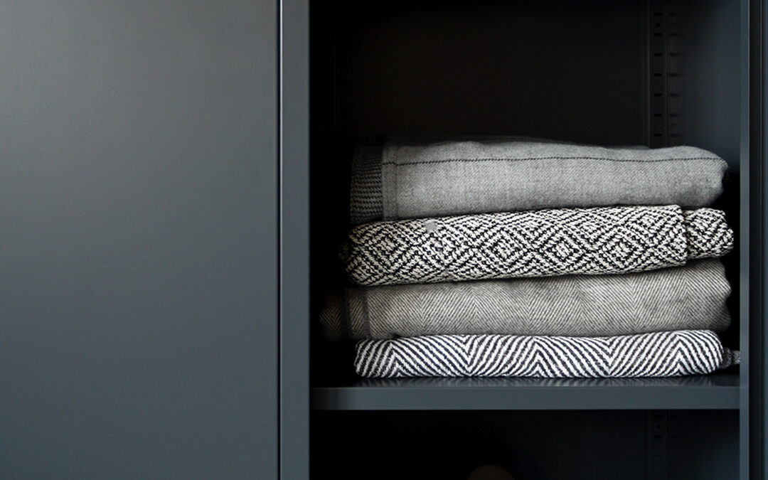 wardrobe metal storage locker in slate grey shown close up with one door open