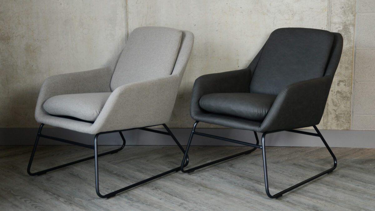 light grey and charcoal grey armchairs with a black painted sled bases