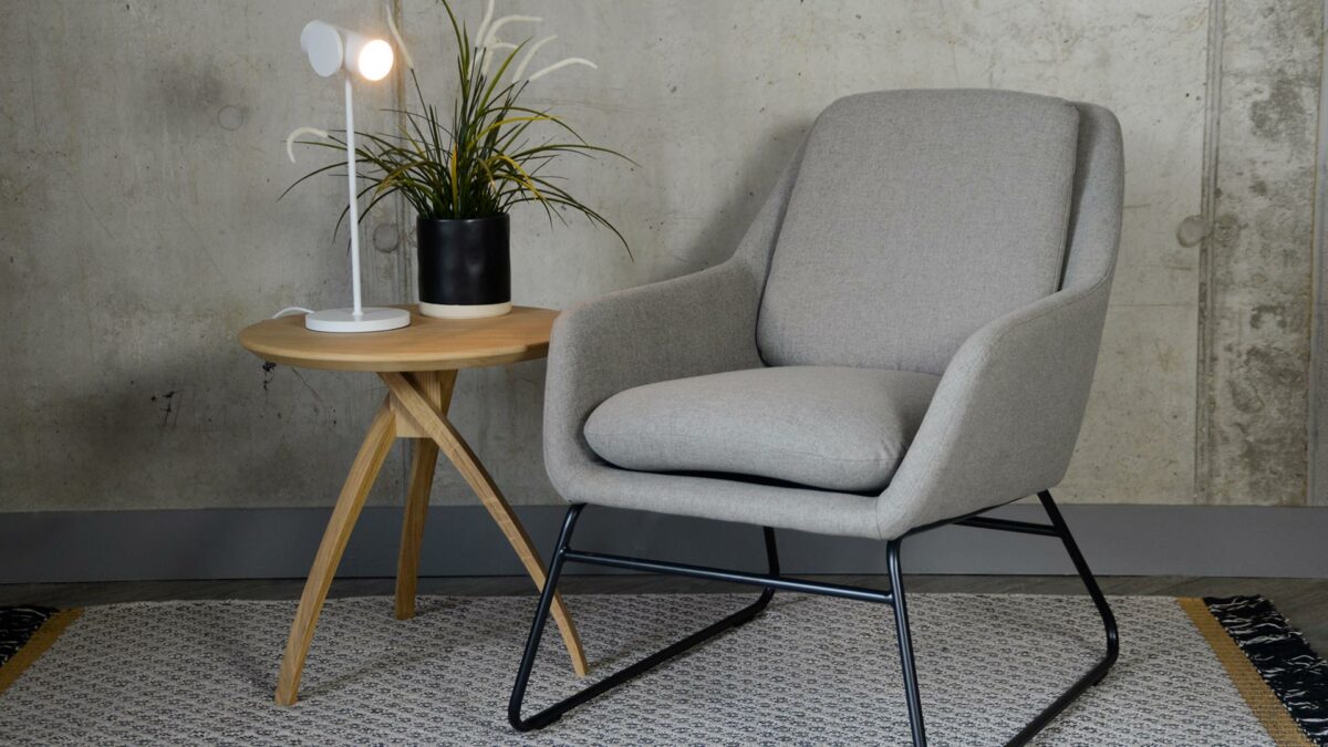 grey armchair with a black painted sled base