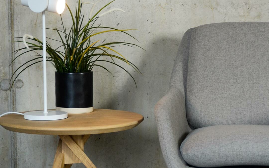 grey armchair with a black painted sled base