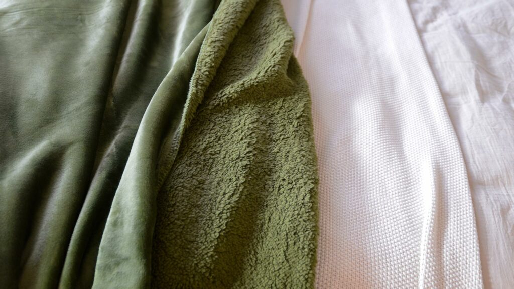 soft and cosy microfibre fleece throw in Olive green showing the front and reverse