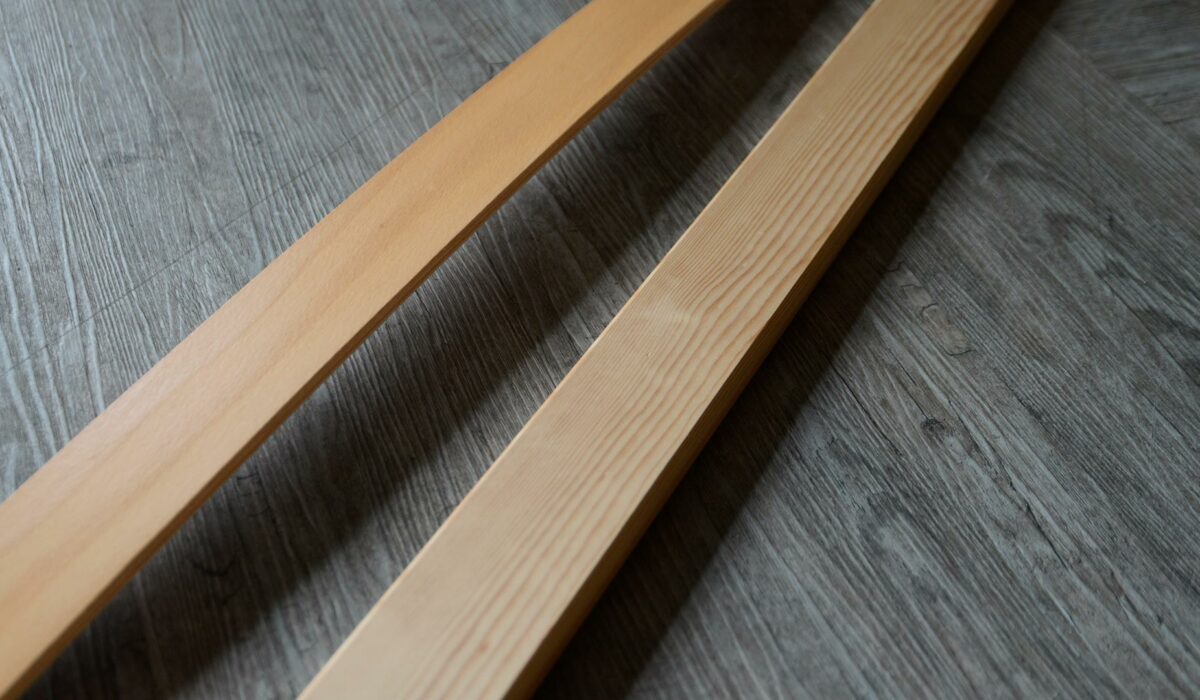 laminated Beech sprung slat shown with a solid Pine wood slat