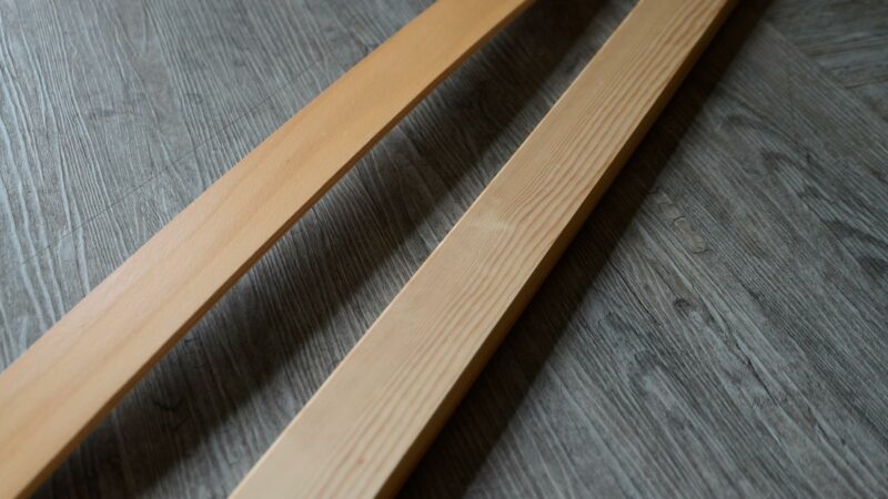 laminated Beech sprung slat shown with a solid Pine wood slat