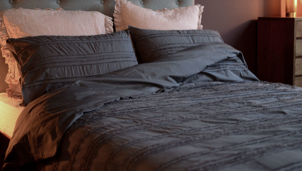 Studio-Collection-Graphite-bedding-with-pink-cushions