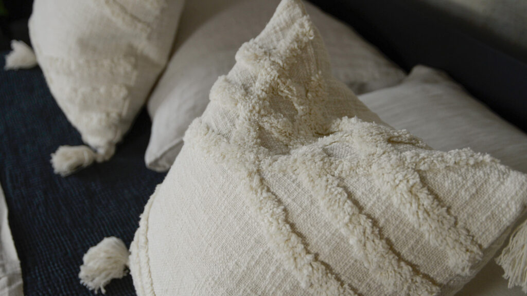 Morocco inspired tufted and tasselled ivory cushions