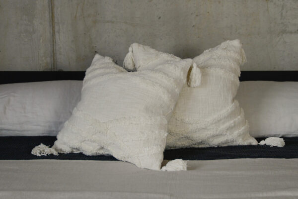 Morocco inspired tufted and tasselled ivory cushions