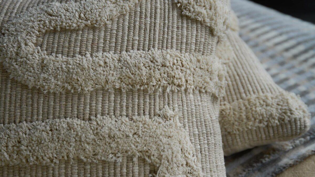 moroccan inspired tufted ecru cushions shown close up