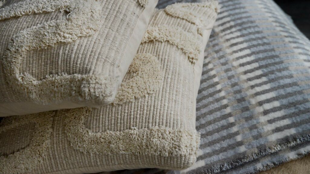 moroccan inspired tufted cream cushions