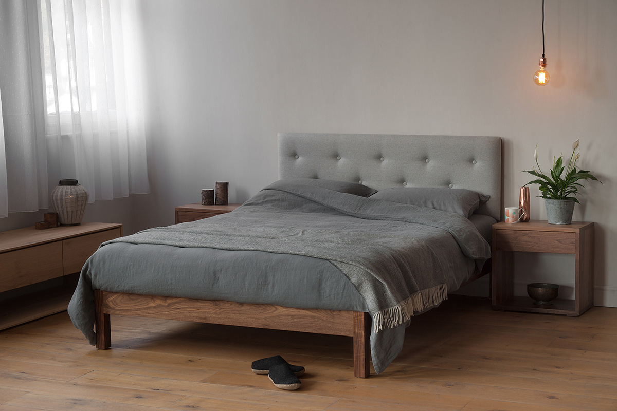 The New Arran Bed with an upholstered buttoned headboard