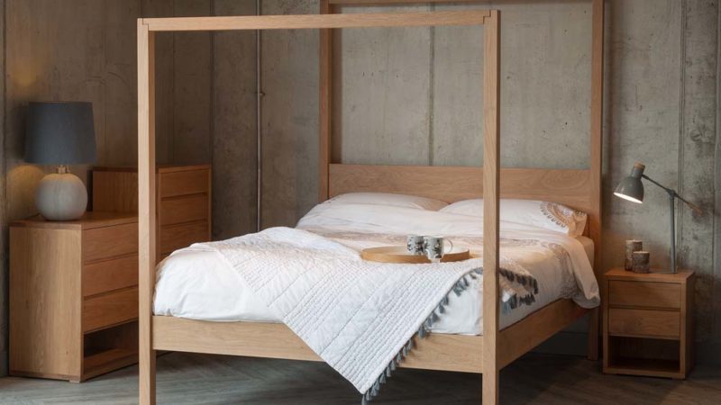 The Oasis Modern solid wood Canopy Bed shown in Oak