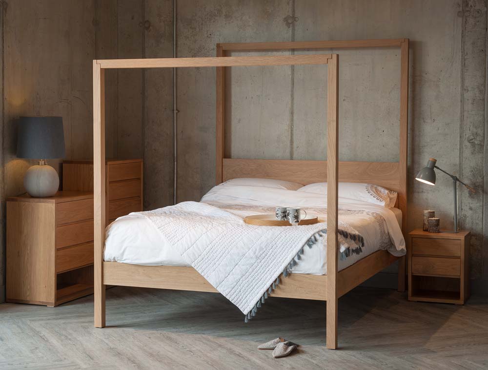 The Oasis Modern solid wood Canopy Bed shown in Oak