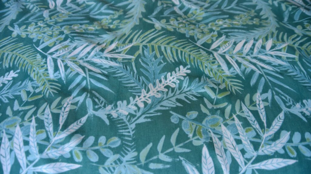 Teal-coloured tropical leaves print duvet cover set a closer view