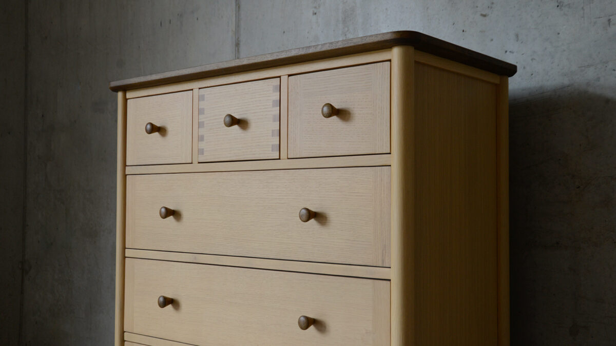 Two Tone 7 drawer chest front angled view