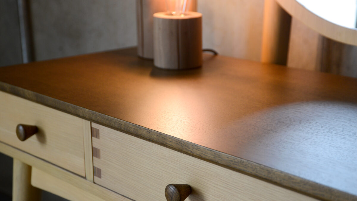 Arts and Craft style Dressing table with 3 drawers in natural oak with a dark stained top