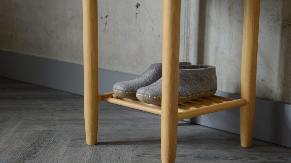 a close-up of the circular bedside table lower shelf